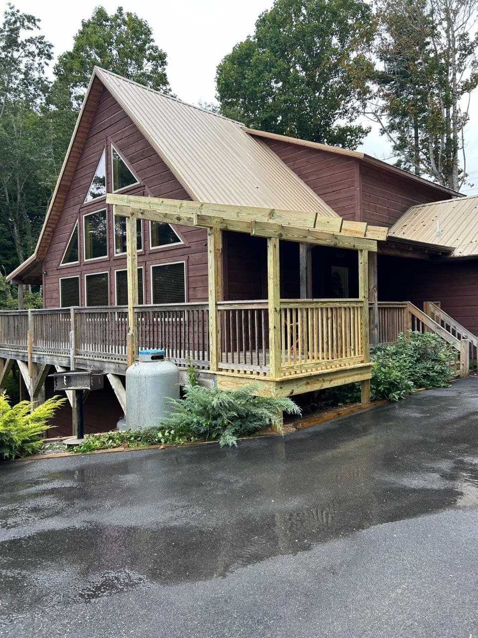 Pergola frame construction over a cabin porch