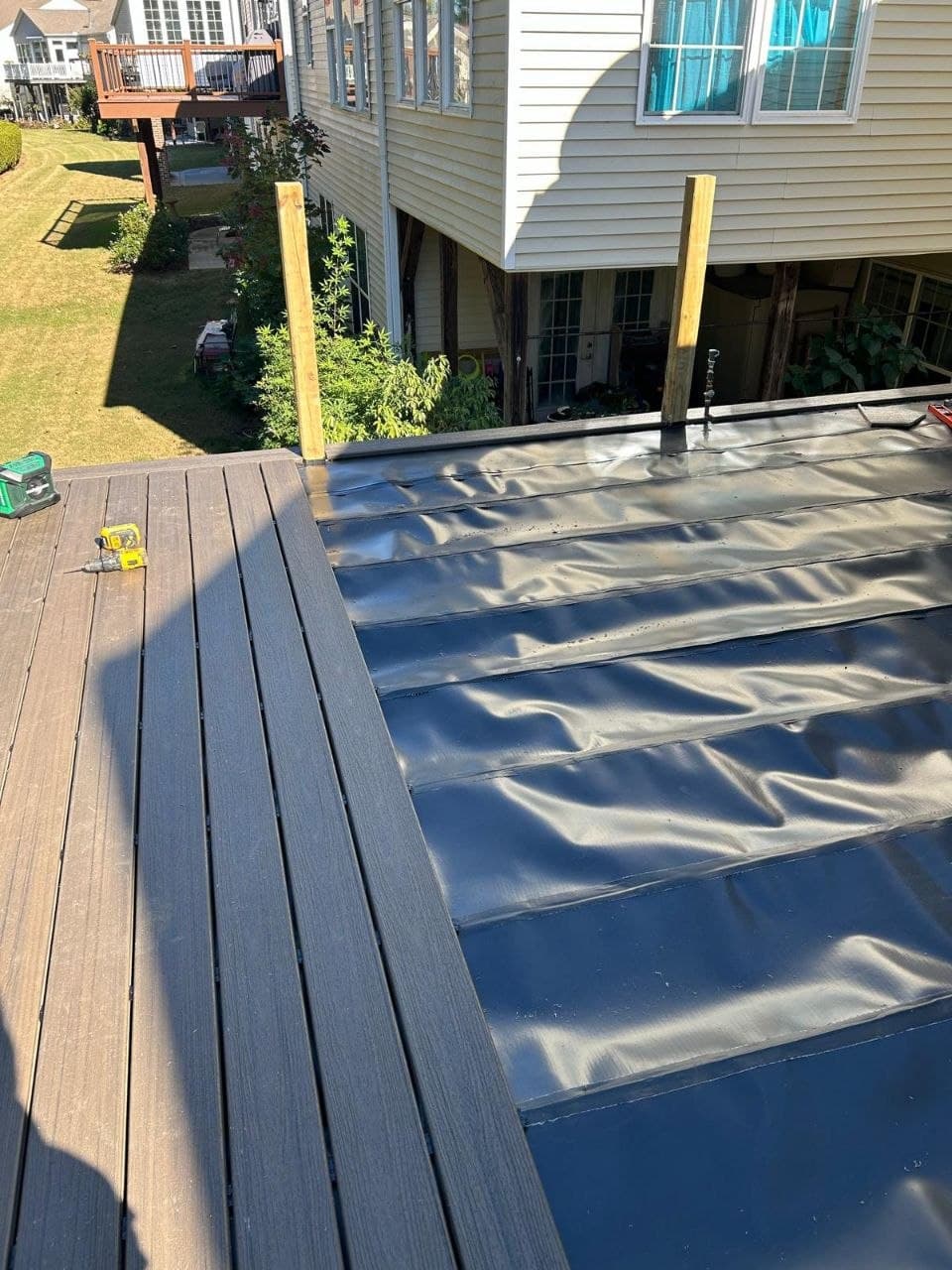 Composite boards installed over waterproofed frame