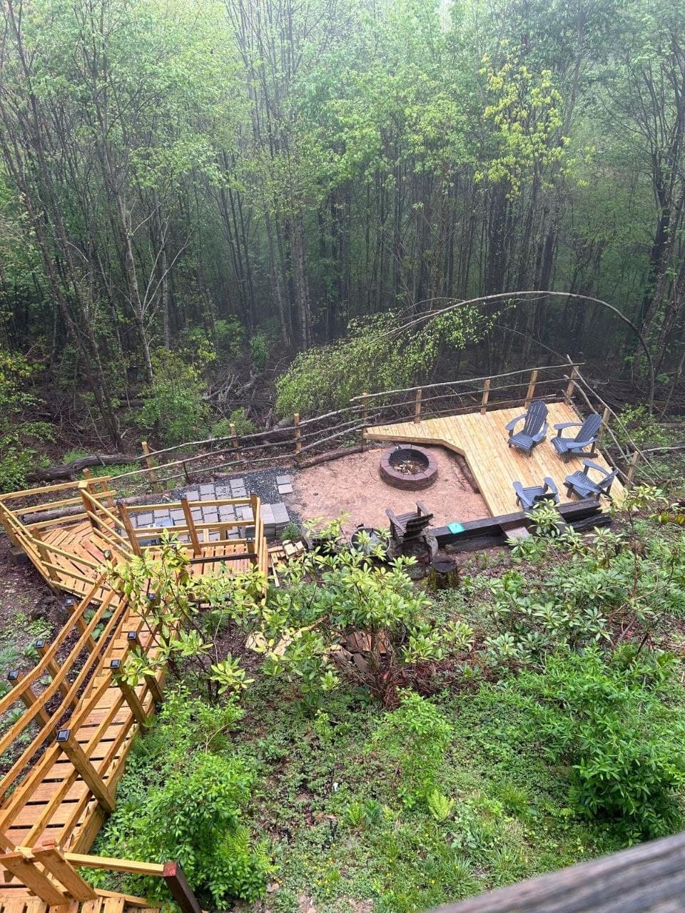Fire-pit deck on a wooded hillside