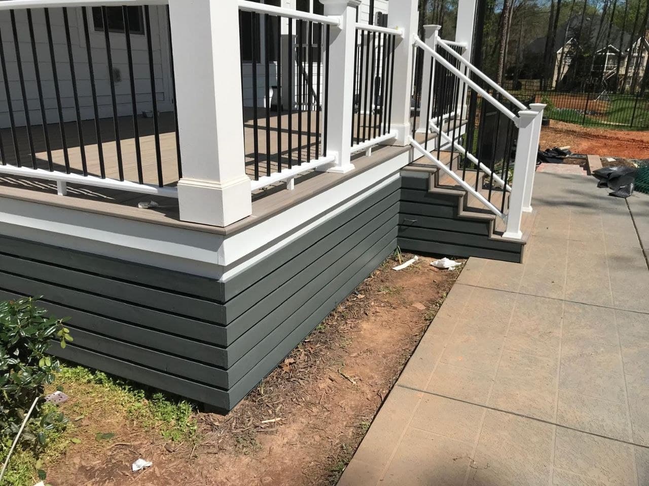 Composite deck with white posts and black balusters