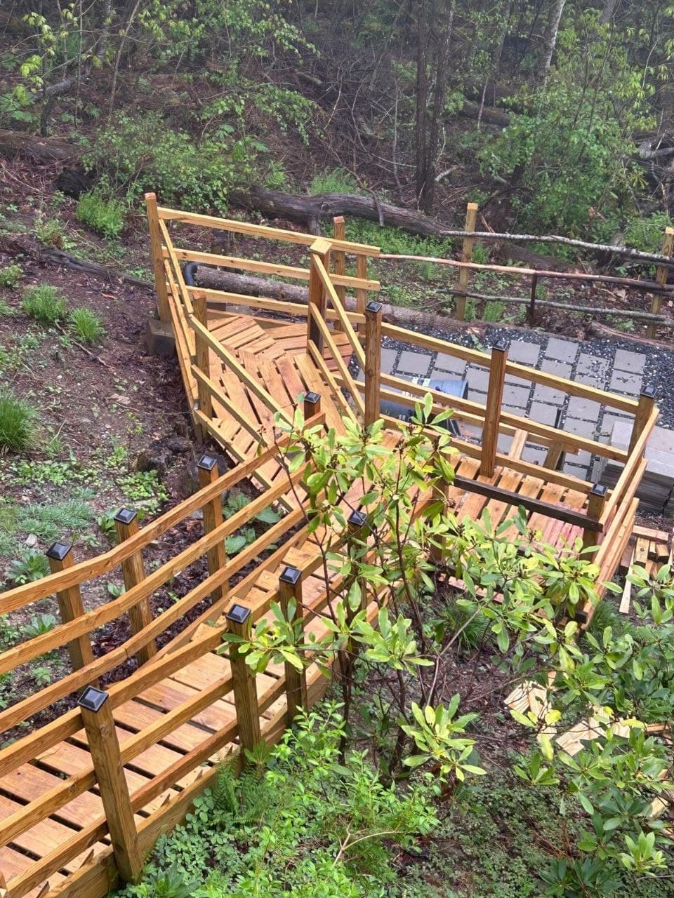 Wooden outdoor structure and walkway on a hillside
