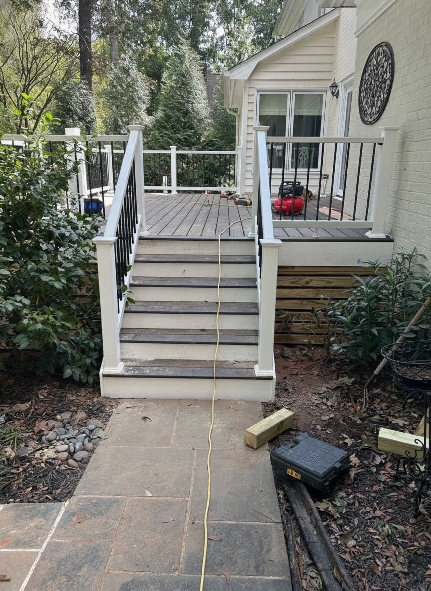 New composite deck with white railings during construction
